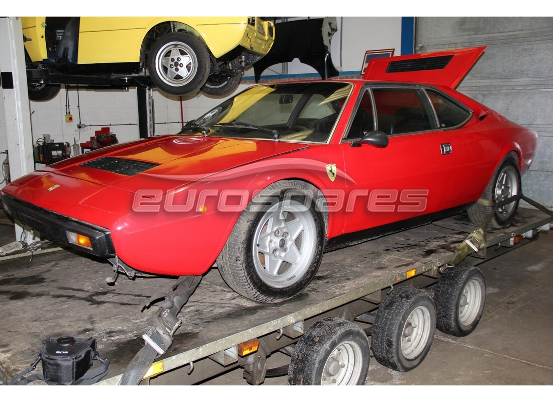 ferrari 308 gt4 dino (1979) being prepared for dismantling at eurospares