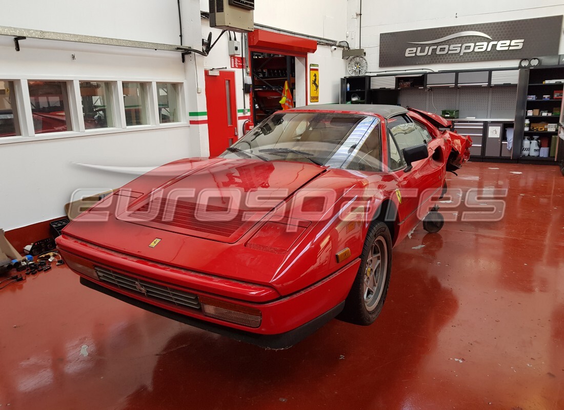 Ferrari 328 (1988) getting ready to be stripped for parts at Eurospares