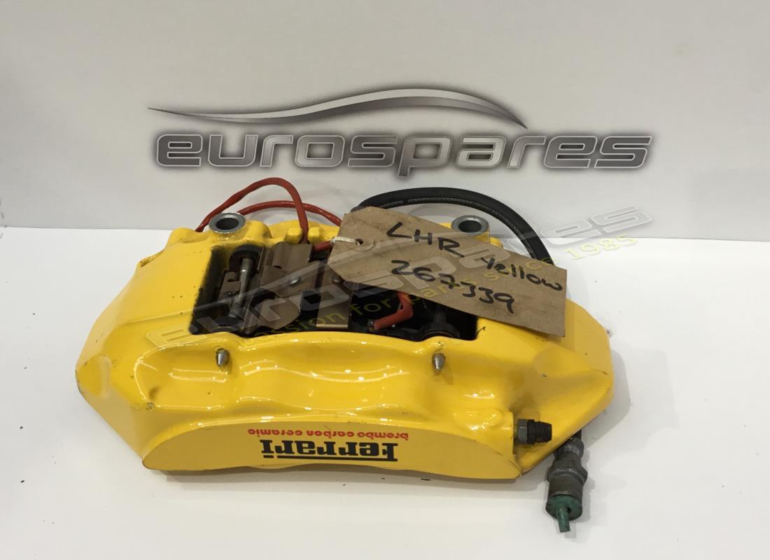 USED FERRARI LH REAR CALIPER WITH PADS YELLOW. PART NUMBER 267339 (1) used ferrari lh rear caliper with pads yellow. part number 267339 (1)