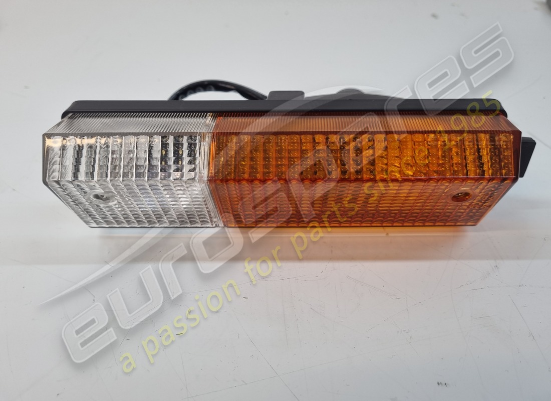 NEW FERRARI LH FRONT INDICATOR & SIDE LAMP UNIT WITH ORANGE/CLEAR LENS. PART NUMBER 60121100 (1) new ferrari lh front indicator & side lamp unit with orange/clear lens. part number 60121100 (1)