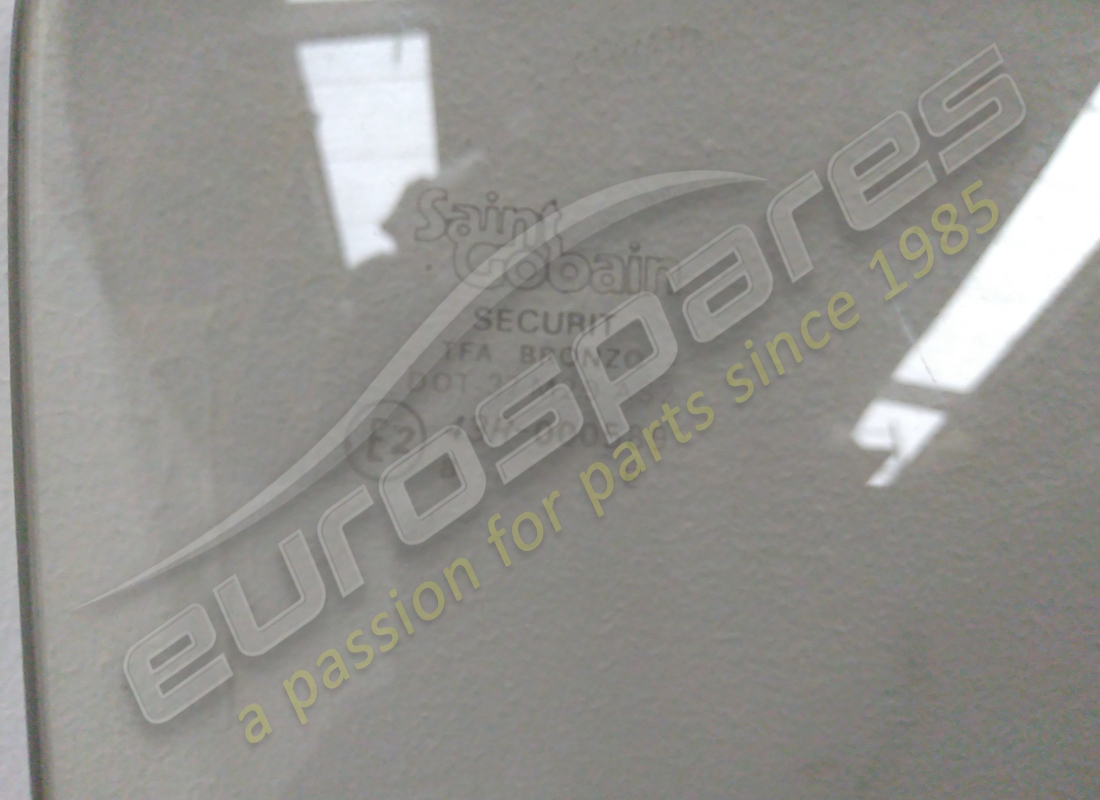 NEW FERRARI RH BRONZE DOOR GLASS. PART NUMBER 2573055400 (2) new ferrari rh bronze door glass. part number 2573055400 (2)