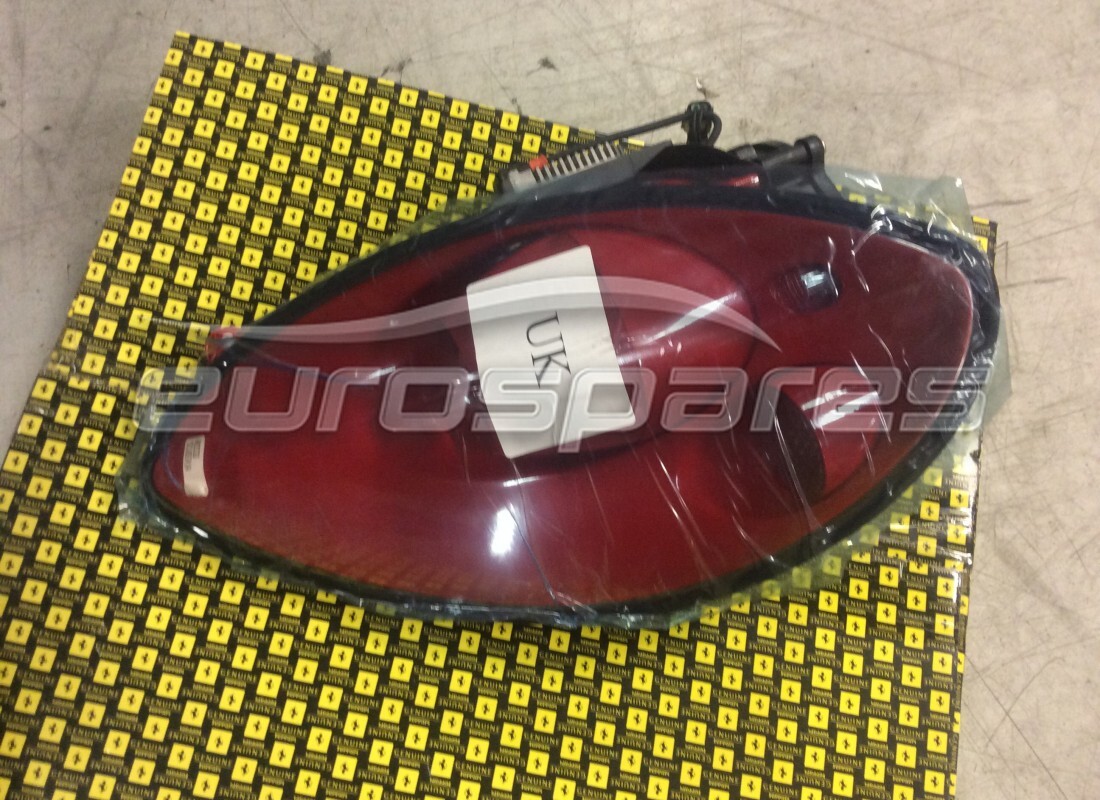 NEW FERRARI LH HEAD LAMP ROSSO SCUD. PART NUMBER 72149687 (1) new ferrari lh head lamp rosso scud. part number 72149687 (1)