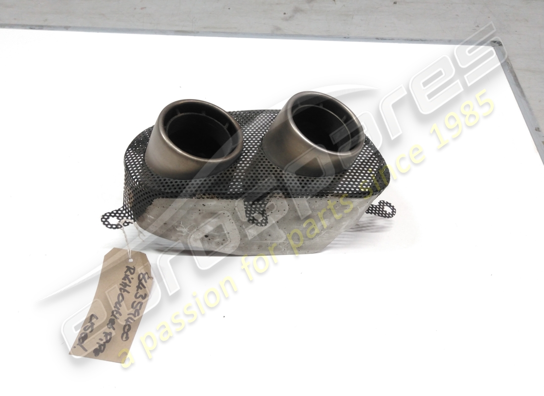 USED FERRARI GRILLE WITH RH TAILPIPES. PART NUMBER 84359400 (2) used ferrari grille with rh tailpipes. part number 84359400 (2)