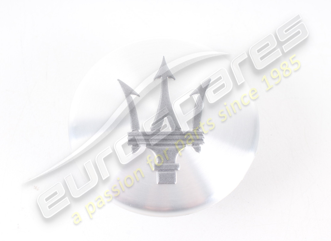 NEW MASERATI WHEEL BADGE - SILVER/GREY. PART NUMBER 82336806 (2) new maserati wheel badge - silver/grey. part number 82336806 (2)