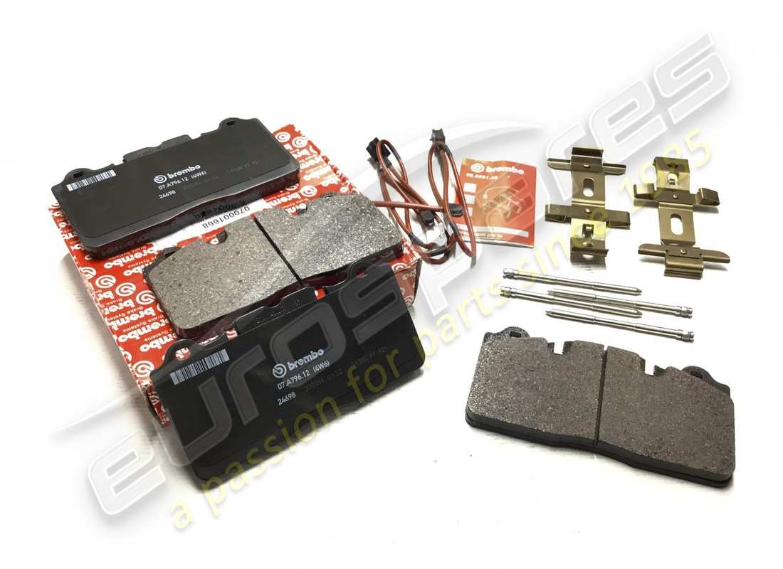 NEW FERRARI FRONT PADS SET WITH SPRING. PART NUMBER 70001668 (1) new ferrari front pads set with spring. part number 70001668 (1)