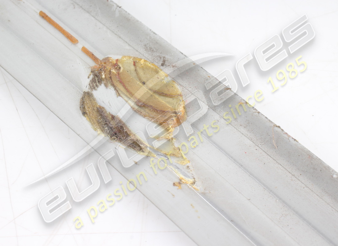 USED FERRARI DOOR KICK STRIP. PART NUMBER 60116704 (4) used ferrari door kick strip. part number 60116704 (4)