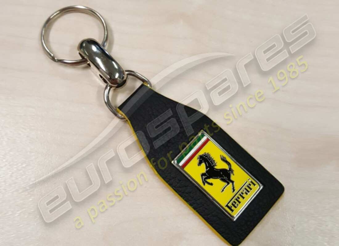 NEW FERRARI KEYRING, BLACK WITH YELLOW EDGE. PART NUMBER 70006151 (1) new ferrari keyring, black with yellow edge. part number 70006151 (1)